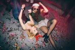 drunk women on the floor of a club featured