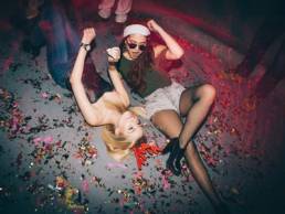 drunk women on the floor of a club featured