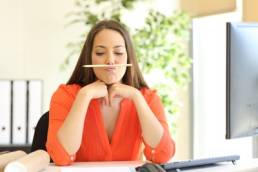 woman time wasting in the office featured