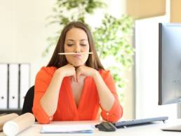 woman time wasting in the office featured