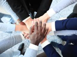 team holding hands, mental health featured