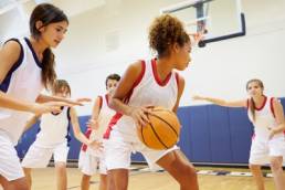 girls playing sport featured