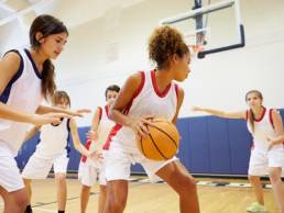 girls playing sport featured