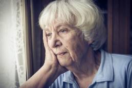 old woman sad about pensions featured