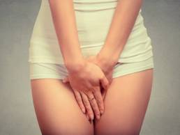 woman holding vagina featured