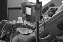 Woman in hospital, breast cancer featured