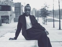 woman in power suit featured