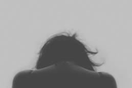 sad, stressed woman suffering burnout featured