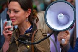 woman with a megaphone featured