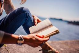 woman reading a book featured