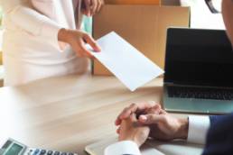 woman handing in her resignation, resigned, quitting, corporate life