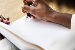 woman writing, dyslexia featured