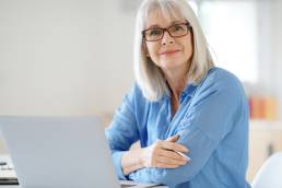 Senior businesswoman working in office, menopause