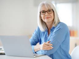 Senior businesswoman working in office, menopause
