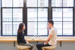 man and woman talking, coffee, communication featured