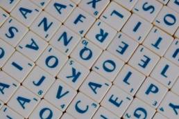 scrabble tiles, suitcase words featured