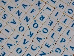 scrabble tiles, suitcase words featured