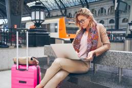 woman in train station, SheTravel featured