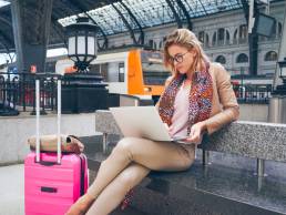 woman in train station, SheTravel featured