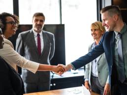 woman shaking hands, women in senior positions featured