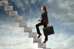 woman climbing a career ladder