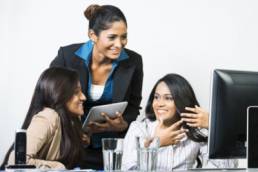 Diverse women in a meeting featured