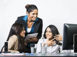 Diverse women in a meeting featured