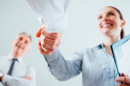 woman shaking hands, job interview, strengths, personal impact