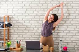 woman stretching in the office, office exercise, workout