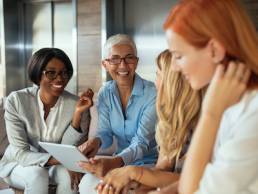 Happy business woman working together online on a tablet, menopause