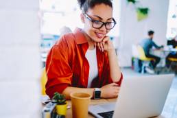 woman watching a webinar, virtual
