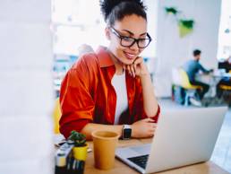 woman watching a webinar, virtual