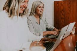 balancing work and relationships, couple working on laptops together