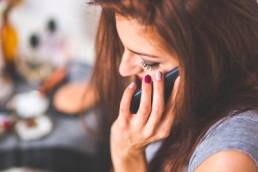 woman talking on the phone while working from home