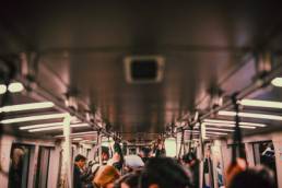 returning to work, commuters on a train going to the office