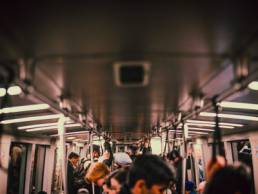 returning to work, commuters on a train going to the office