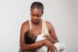 African black woman breastfeeding her child