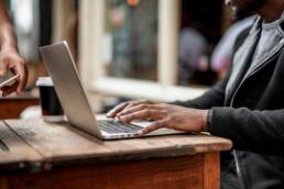 Businessman working remotely from a cafe, flexible working