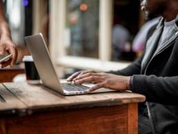 Businessman working remotely from a cafe, flexible working