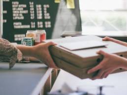 woman buying pizza from a local business, shop local, Erica Wolfe Murray