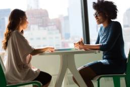 two women having a face-to-face interview, contact, talking