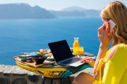 Woman working while on vacation in Mediterranean, work from here