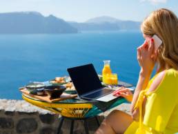Woman working while on vacation in Mediterranean, work from here