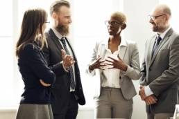 group of diverse people in corporate environment, women in finance