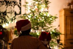 parent and child looking at Christmas tree, work-life balance, festive season