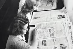 women reading newspapers, news