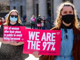 Demonstrators hold up signs at a protest in Dublin to highlight violence against women in the wake of the murder of Sarah Everard, misogyny