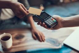 Female entrepreneur taking contactless payment