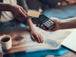 Female entrepreneur taking contactless payment