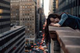 woman lying on wall in New York, lockdown fatigue